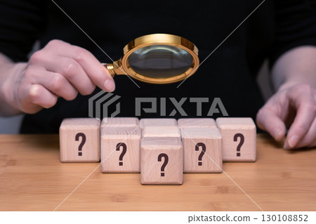 Exploring mysteries with a magnifying glass and wooden blocks. 130108852