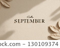 The image features the words 'Hello September' on a textured beige background with shadows and leaves around the edges. 130109374