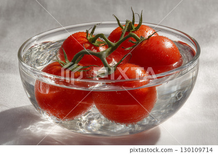 Tomatoes in a glass container, fresh tomatoes 130109714