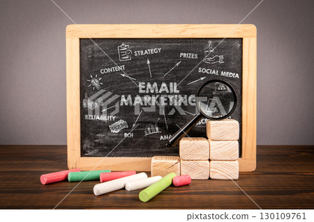 Email Marketing Strategy Concept on Blackboard with Icons, Magnifier and Chalk Elements 130109761