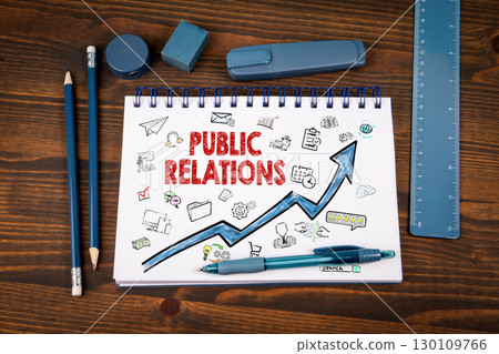 Public Relations Strategy with Doodles and Growth Arrow on Notepad in Office Environment Public Relations Strategy with Doodles and Growth Arrow on Notepad in Office Environment 130109766