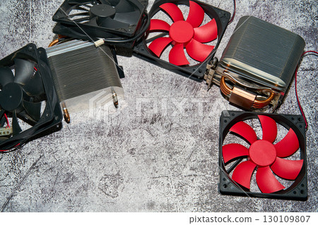 From above of vintage red CPU cooler also called PC cooling fan placed on surface 130109807