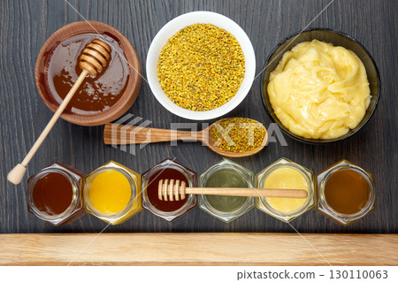 Hexagonal jars with different types and colors of fresh flower honey Hexagonal jars with different types and colors of fresh flower honey 130110063