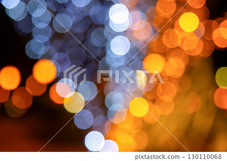 Vibrant golden and multicolored light bokeh on a dark canvas Vibrant golden and multicolored light bokeh on a dark canvas 130110068