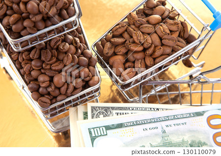 A shiny gold background hosts a cart of coffee beans 130110079