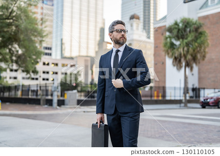 Successful leadership. Business success. Business leader outdoor. Businessman in suit. Business leadership. Best leader. Successful businessman. Project leader in the street of New York 130110105