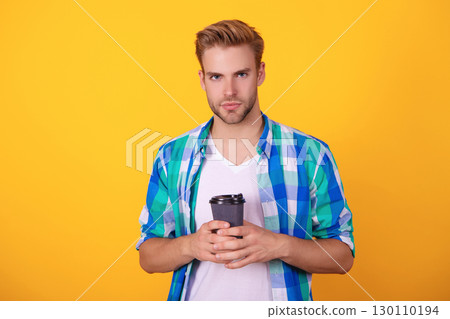 Morning coffee time. Lifestyle concept. Drinking espresso. Man drinking tea. Warm morning. Coffee break at home. Millennial man having coffee cup isolated on yellow. Morning habit 130110194