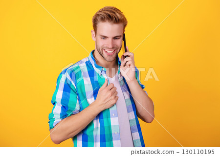 Calling back. Man talk on smartphone. Phone call. Mobile communication. Nice conversation. Man speak on smartphone isolated on yellow. Millennial man has phone conversation Calling back. Man talk on smartphone. Phone call. Mobile communication. Nice conversation. Man speak on smartphone isolated on yellow. Millennial man has phone conversation 130110195