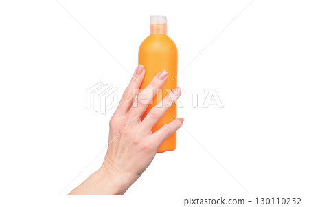female hands hold lotion bottle with copy space female hands hold lotion bottle with copy space 130110252