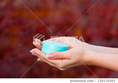 hands holding cream jar for skincare. cosmetic hands holding cream jar for skincare. cosmetic 130110263