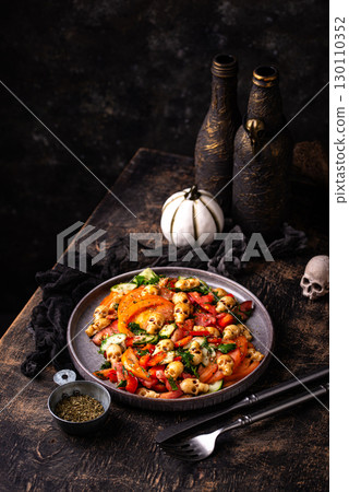 Halloween salad with cheese in shape of skull 130110352
