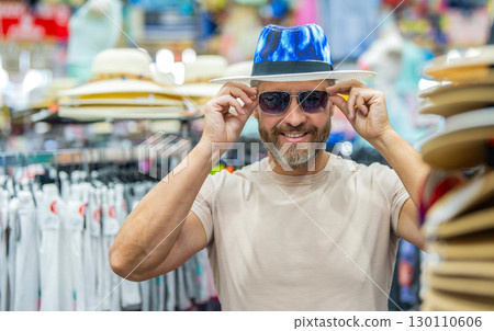 Stylish man in hat boutique. Mature man choosing hat. Expensive fashion male accessories. Fashionable clothes. Fashion store. Hat male fashion shop. Man shopping fashion hat, banner Stylish man in hat boutique. Mature man choosing hat. Expensive fashion male accessories. Fashionable clothes. Fashion store. Hat male fashion shop. Man shopping fashion hat, banner 130110606