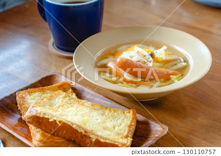 Breakfast with French toast and vegetable soup with sausage 130110757