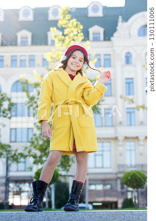 ebook technology. cheerful parisian girl in french beret. autumn fashion. school fall season. little girl child listen audio book. little girl in headset. online education. music lover. heart of town 130111006
