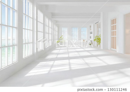 Sunny room with wide windows and white interior. Flowers in vase glow under natural light. Great for minimalist living space inspiration. 130111246