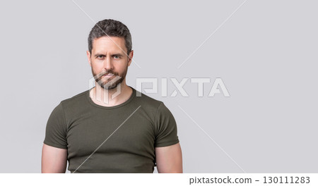 caucasian guy with stubble in studio with copy space. photo of caucasian guy with stubble. caucasian guy with stubble in studio with copy space. photo of caucasian guy with stubble. 130111283