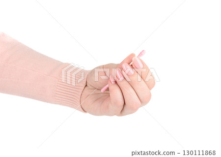 Pink cotton swab in fingers of young woman against white background. Pink cotton swab in fingers of young woman against white background. 130111868