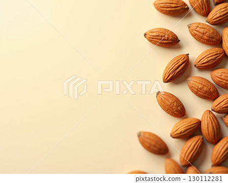 Close-up Minimalist Almond Group Arrangement on Light Yellow Background Food 130112281