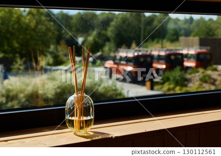 A serene view featuring a calming atmosphere with a diffuser and charming vintage vehicles A serene view featuring a calming atmosphere with a diffuser and charming vintage vehicles 130112561