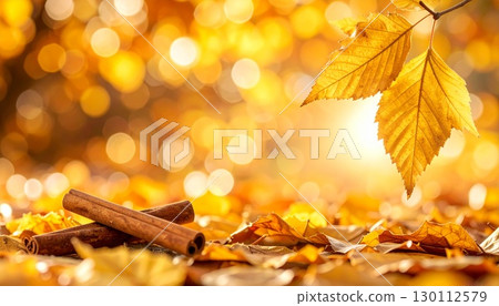 Small cinnamon sticks on an autumn background 130112579