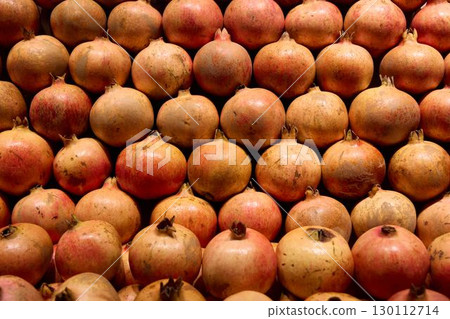 A Variety of Fresh Pomegranates Beautifully Displayed for Sale in the Local Market 130112714