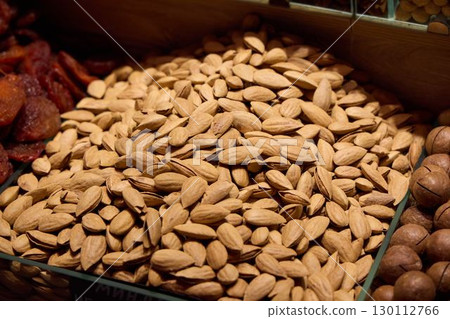 A Beautiful Display of Fresh Almonds at the Local Market is Truly Appealing and Inviting A Beautiful Display of Fresh Almonds at the Local Market is Truly Appealing and Inviting 130112766
