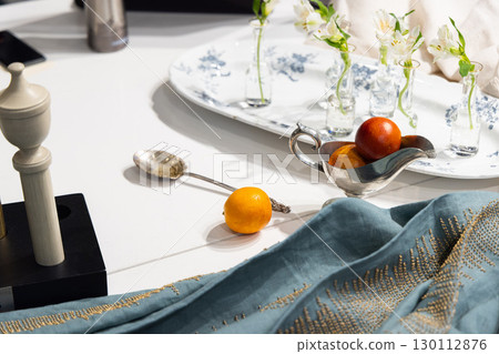 An Elegant Table Setting Featuring Diverse Decorative Elements Alongside Delicious Cuisine An Elegant Table Setting Featuring Diverse Decorative Elements Alongside Delicious Cuisine 130112876