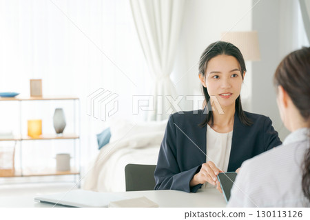 A woman explaining a product A woman explaining a product 130113126