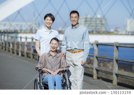 Woman in wheelchair and family 130113159