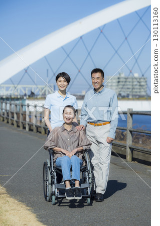 Woman in wheelchair and family 130113160