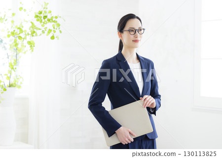 Business woman wearing glasses 130113825