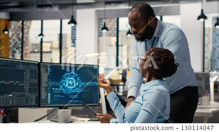 Prop firm staff members using artificial intelligence tech to ensure smooth trading operations. Team of traders in office using AI chatbot to analyze stock market portfolio positions Prop firm staff members using artificial intelligence tech to ensure smooth trading operations. Team of traders in office using AI chatbot to analyze stock market portfolio positions 130114047