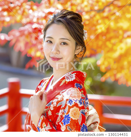 人工智慧生成的身著和服的年輕女子與秋葉的圖像 人工智慧生成的身著和服的年輕女子與秋葉的圖像 130114431