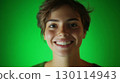 A cheerful face illuminated by soft lighting emphasizing community spirit 130114943