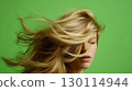 Hair is neatly styled framing the face well 130114944