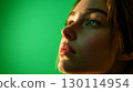 A focused face illuminated by natural light deep in thought 130114954