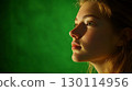 Soft lighting illuminates the subjects face creating a warm and inviting aura 130114956