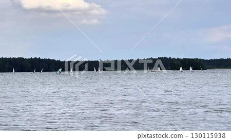 Sail serene lakes and oceans, enjoying natures beauty, leisure, and scenic landscapes 130115938