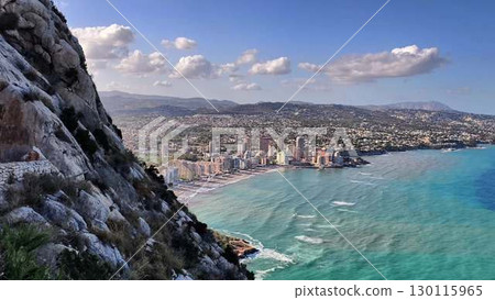 Experience the captivating and breathtaking coastal view of a modern cityscape right by the sea 130115965