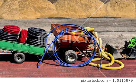 A colorful assortment of equipment and various materials is present at the construction site 130115979