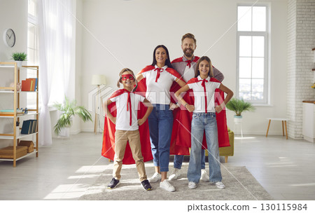 Portrait of fun family with two children playing together and pretending to be superheroes. Portrait of fun family with two children playing together and pretending to be superheroes. 130115984