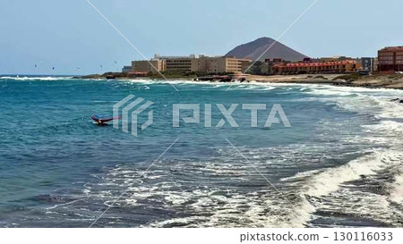 Enjoy vibrant coastal waters with thrilling surf action and a stunning scenic backdrop 130116033