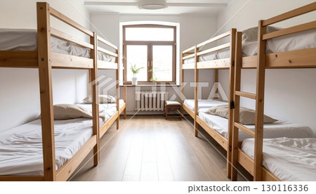 Luxurious hotel bedroom interior with a comfortable bed, elegant furniture, and a large window Luxurious hotel bedroom interior with a comfortable bed, elegant furniture, and a large window 130116336