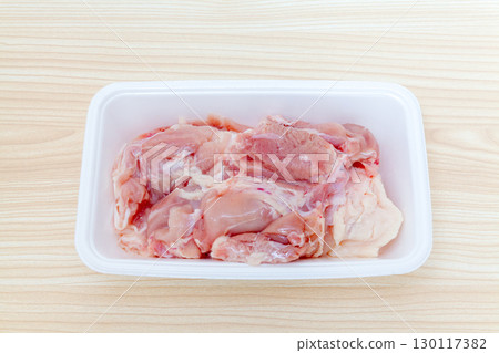 Chicken thigh block in a food pack Chicken thigh block in a food pack 130117382