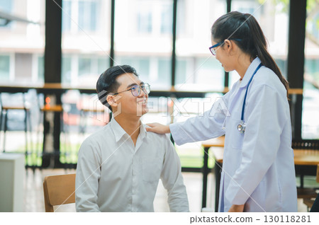 doctor hand holding the patient's hand. To encourage and comfort the patient so that the patient is not sad and worried. 130118281