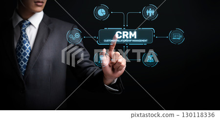 Professional Businessman Interacting with Digital CRM System for Enhanced Customer Relationship Management in an Online Environment XDMCP Professional Businessman Interacting with Digital CRM System for Enhanced Customer Relationship Management in an Online Environment XDMCP 130118336