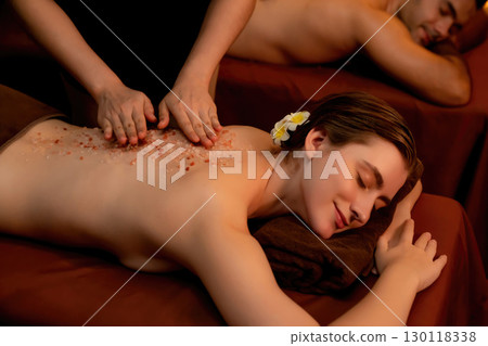 Couple customer having exfoliation treatment in luxury spa. Quiescent 130118338