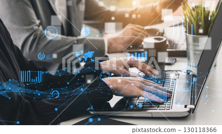 Professional business people using laptops in modern office environment with data analysis graphics and charts showcasing digital transformation and collaboration xenic 130118366