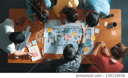 Top down view of engineer writing and planning by using sticky notes. Symposium. Top down view of engineer writing and planning by using sticky notes. Symposium. 130118436