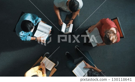 Top down view of prayer reading at bible book and sitting in circle. Symposium. 130118641